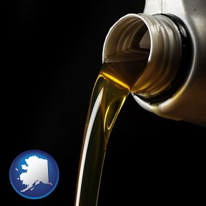pouring motor oil, on a black background - with Alaska icon
