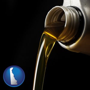 pouring motor oil, on a black background - with Delaware icon