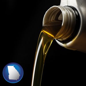 pouring motor oil, on a black background - with Georgia icon