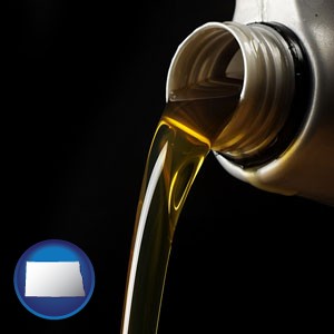 pouring motor oil, on a black background - with North Dakota icon
