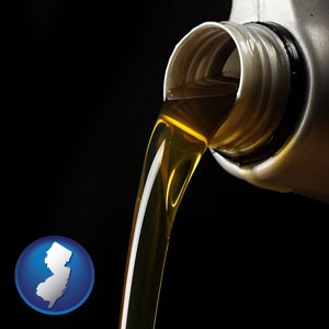 pouring motor oil, on a black background - with New Jersey icon