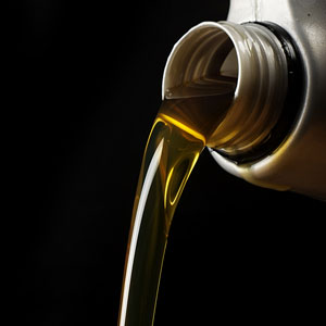 pouring motor oil, on a black background