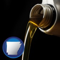 arkansas pouring motor oil, on a black background