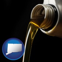 connecticut pouring motor oil, on a black background