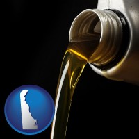 delaware pouring motor oil, on a black background