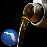 florida pouring motor oil, on a black background
