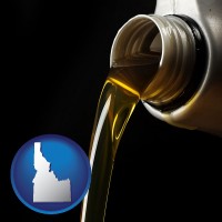 idaho pouring motor oil, on a black background
