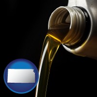 kansas pouring motor oil, on a black background