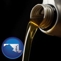 maryland pouring motor oil, on a black background