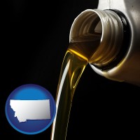 montana pouring motor oil, on a black background