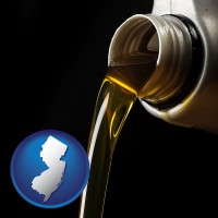 new-jersey pouring motor oil, on a black background