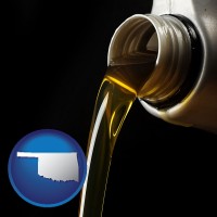 oklahoma pouring motor oil, on a black background