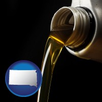 south-dakota pouring motor oil, on a black background
