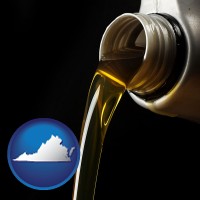 virginia pouring motor oil, on a black background